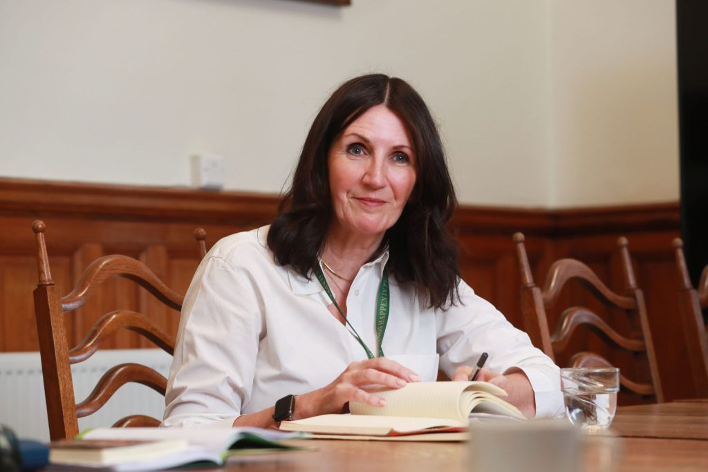 A woman sitting at a desk