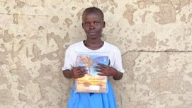 Girl standing holding a book