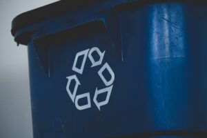 A bin with a recycling logo on it